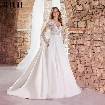 ייחודי חתונה לבנה שמלות עם כיסים סקסית צוואר V שרוולים ארוכים אפליקציות תחרה שמלות כלה סאטן לטאטא אורך החלוק De Mariée